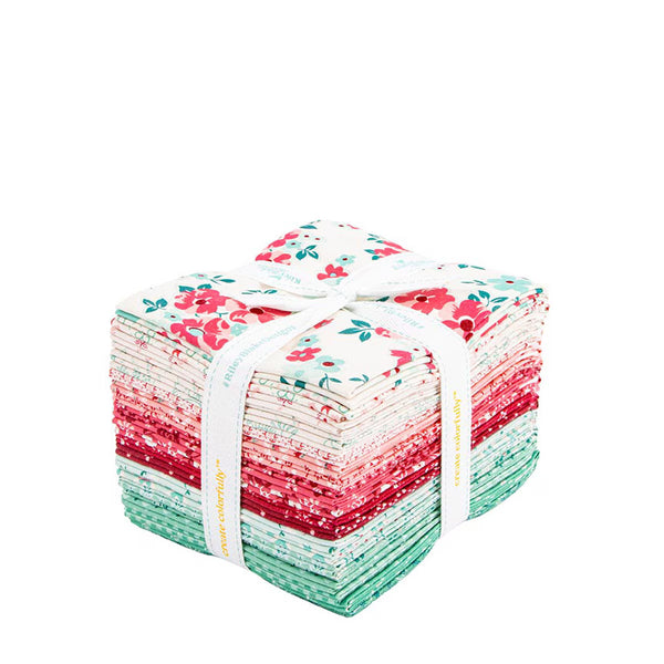 Stack of fabric squares with floral patterns tied together on a white background