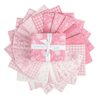 Collection of pink fabric squares with a central bundle, on a white background