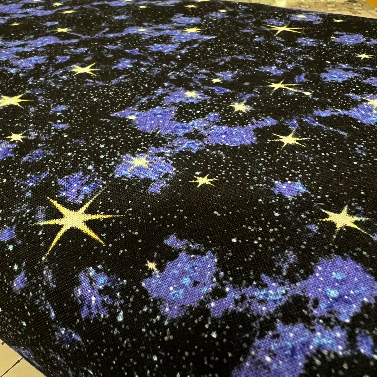 In Space Blue Galaxy Quilting Fabric by Elizabeth's Studio - Sold by the 1/2 Yard